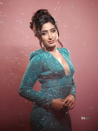 The sparkle of a sequined dress captured with creative lighting. The prism effect adds a dreamy, magical quality to this glamorous portrait.