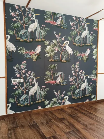 A beautiful wallpaper featuring herons and floral elements on a dark background.