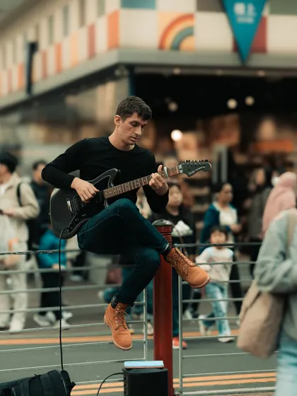 A street musician lost in his craft on a busy Hong Kong street. I love capturing artists and performers in their element, adding to the vibrant soundtrack of the city.