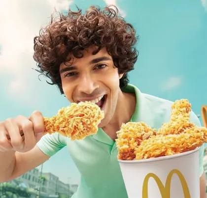This shot from the McDonald's campaign focuses on a male model, maintaining the same vibrant and casual styling to appeal to a broad audience.
