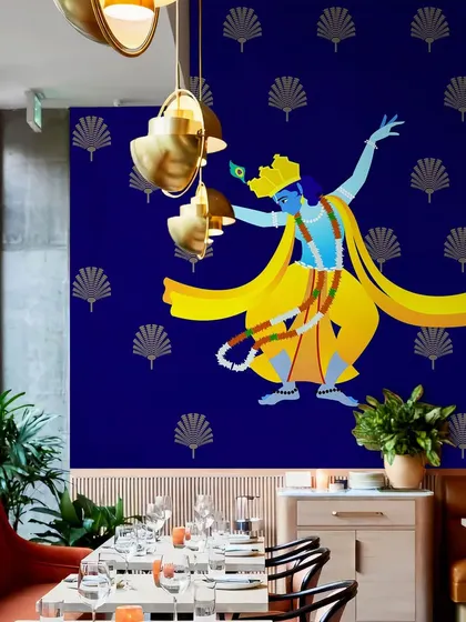 In this restaurant, the Dancing Lord Krishna wallpaper creates a unique and culturally rich dining experience. It’s a bold design choice that is sure to leave a lasting impression on patrons.