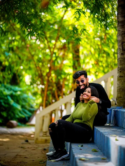 A duplicate of a playful and cute moment on a set of blue stairs.
