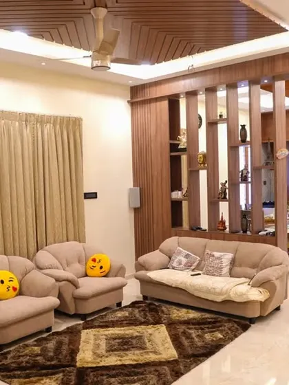 A duplicate image of the comfortable living room setup in the Velachery apartment.