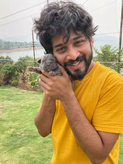 Cuddling with a small puppy. These are the simple moments of joy that I cherish.