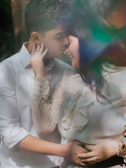 A dreamy, intimate close-up of Shivam and Raghavi, with a light flare effect adding a touch of magic to their romantic pre-wedding portrait.
