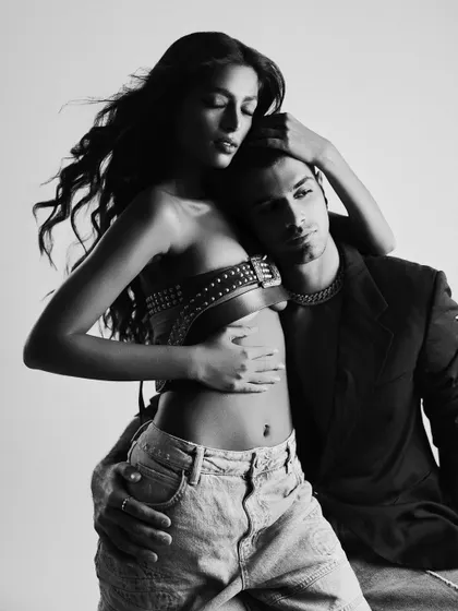 An intimate black and white shot, focusing on the connection and emotion between the couple.