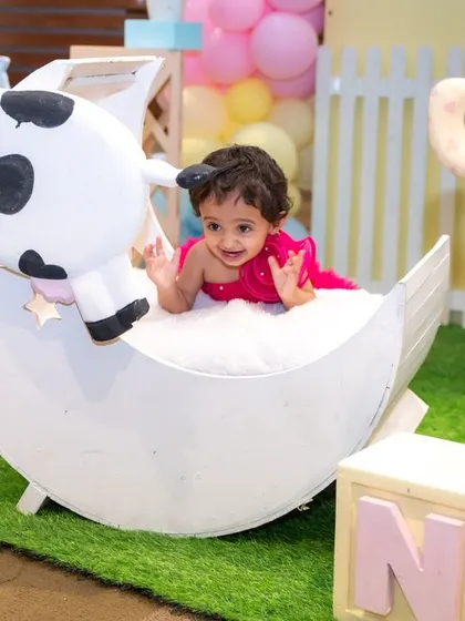 A playful moment in our farm-themed studio setup. We have a variety of props to spark your child's imagination and capture their happy smiles.