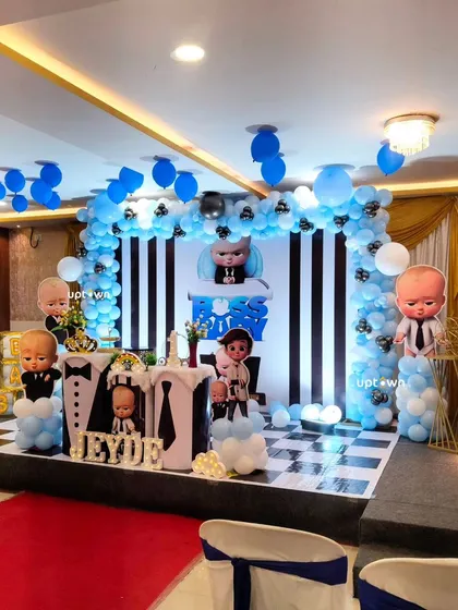 Another view of the Boss Baby party, highlighting the stage and seating arrangement.
