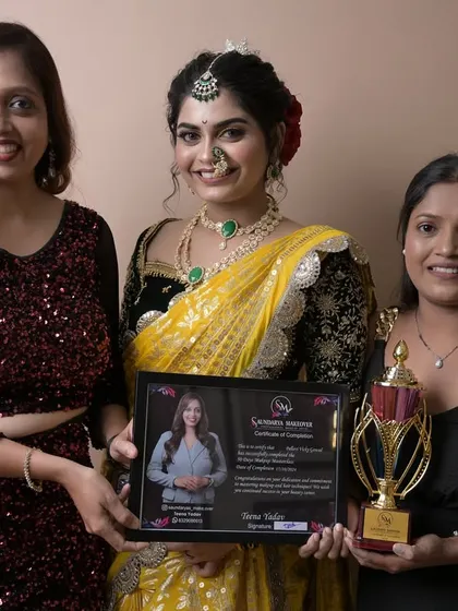 Another proud graduate receiving her certificate. She created a stunning yellow Maharashtrian look for her final exam.