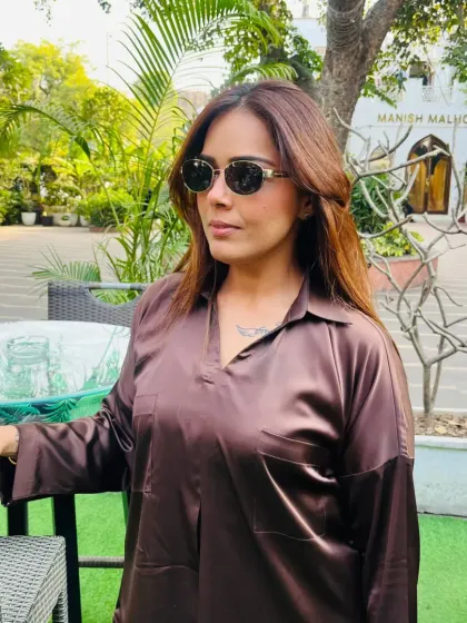 Another look at my work-day chic. A simple satin shirt and sunglasses are my go-to for a look that is both professional and stylish.