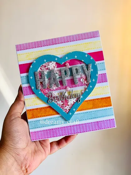 The cover of the pop-up card, featuring a colorful shaker heart with "Happy Birthday" in glittery letters. It's a fun preview of the memories inside.