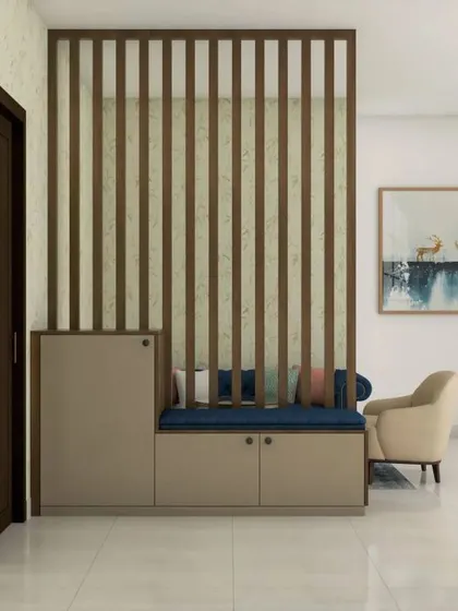 A simple yet effective foyer design with a shoe cabinet and seating bench set against a vertical slat partition. This is a great way to create a defined entryway in an open-plan space.