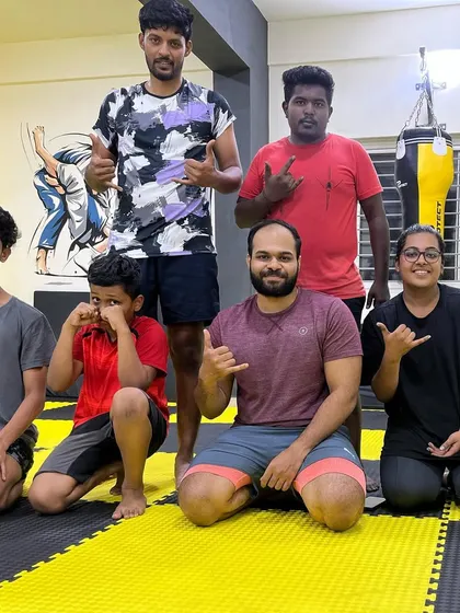 A candid shot of our members after a session, showing the easy camaraderie between our adult and youth trainees.