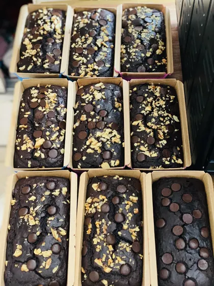 For a healthier indulgence, I offer these whole wheat jaggery tea cakes. This batch shows the different topping options, including walnuts and Belgian chocolate chips, all made without refined flour or sugar.