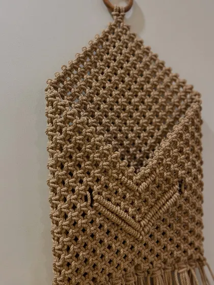 The V-shaped detail on the front of the pocket is a lovely design element. This is a great lifestyle product for a tidy home.