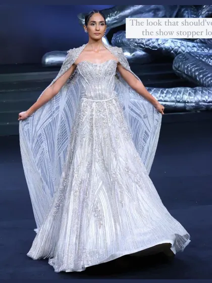 From the Gaurav Gupta couture show, this magnificent white gown with a structured cape was, in my opinion, the true showstopper. It's a perfect example of futuristic, high-drama bridal wear.