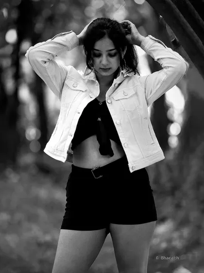 A candid moment captured in black and white. The lack of color draws attention to the emotion and the beautiful natural light.