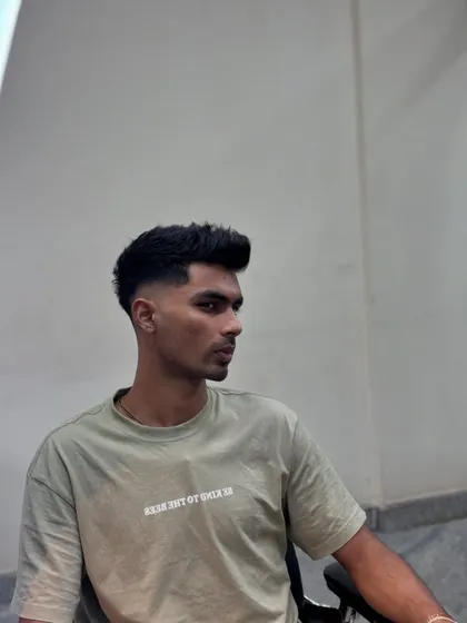 Another angle of the high skin fade, showing how it looks from a distance. The clean lines around the ear are crucial.
