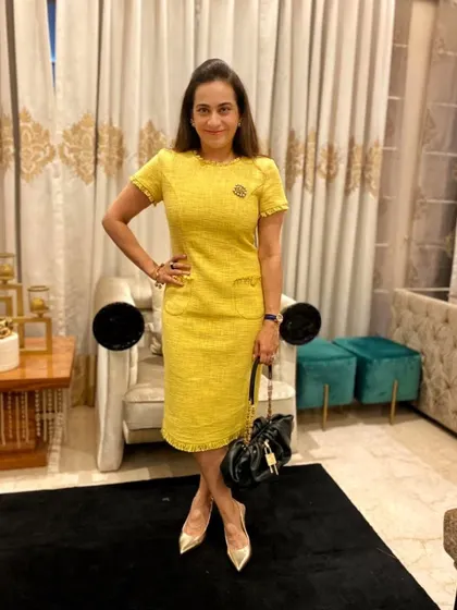 A sneak peek of a new piece from my clothing line. This yellow tweed dress is perfect for transitioning between seasons, and I've styled it here with a black bag and gold heels for a classic look.