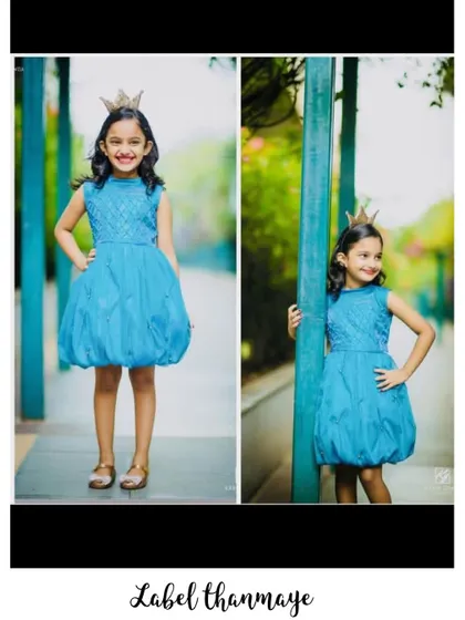 A cute blue balloon frock for a little princess. The bubble hem is a fun detail that kids love.