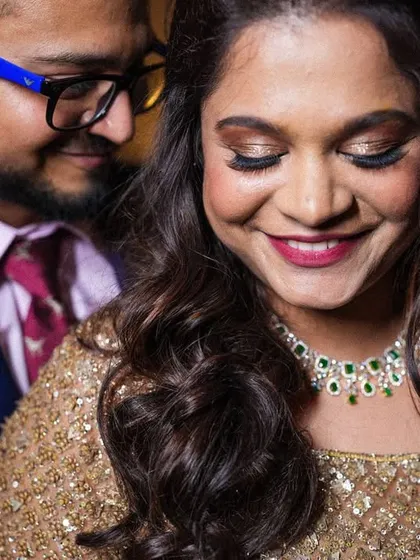 A close-up filled with smiles and affection. The bride's joyful expression is what makes this engagement photo so special.