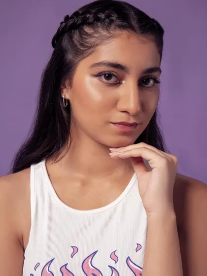 A classic beauty pose, highlighting the model's features and the clean makeup.