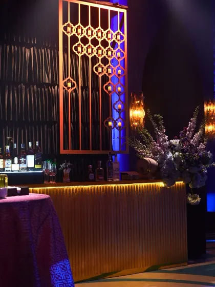 The custom-designed bar at our 'Shaam Sufiana' event. The intricate screenwork and warm lighting added to the moody and textured feel of the evening.