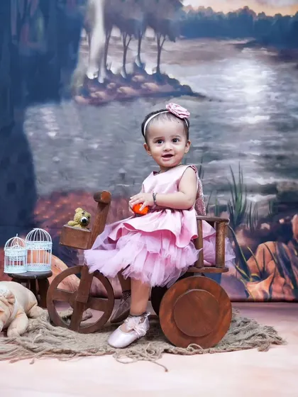 A simple and sweet portrait with a rustic wooden cart prop. Sometimes the best photos come from the simplest setups.