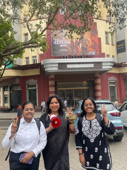 With law students outside a cinema hall in South Mumbai. We are working to combat the low voter turnout, which was only 43 percent in the last election. Come on Mumbai, come out and vote!