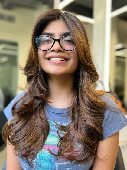 When I make my clients smile, that's real success. This client is happy with her new haircut and beautiful, warm brown color.