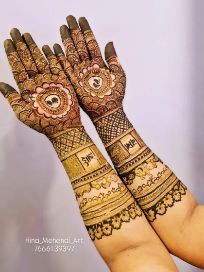 This baby shower mehendi includes the words 'aai' and 'baba' (mom and dad) in Marathi. The palms feature baby feet inside a floral mandala.