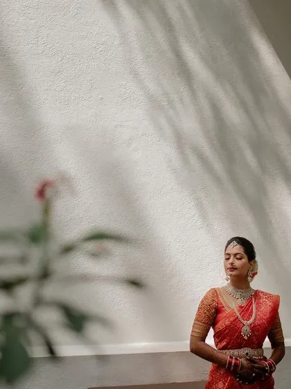 A creative portrait of the bride, using reflections and shadows to create a sense of mystery and art. We love experimenting with different techniques to tell a unique story.