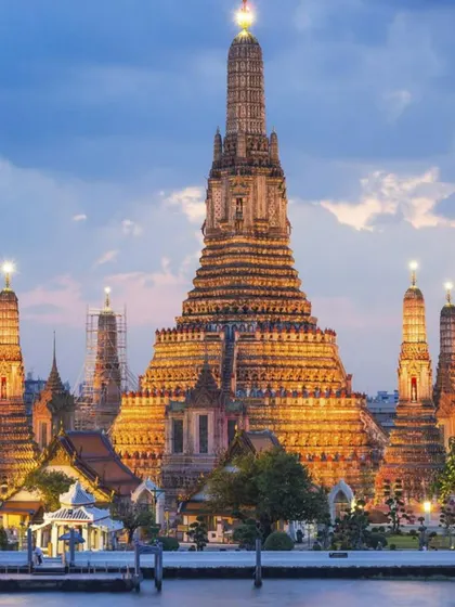 Thailand isn't just beaches. We make sure you experience its rich culture, like visiting the magnificent Wat Arun temple in Bangkok, especially as it lights up beautifully at dusk.