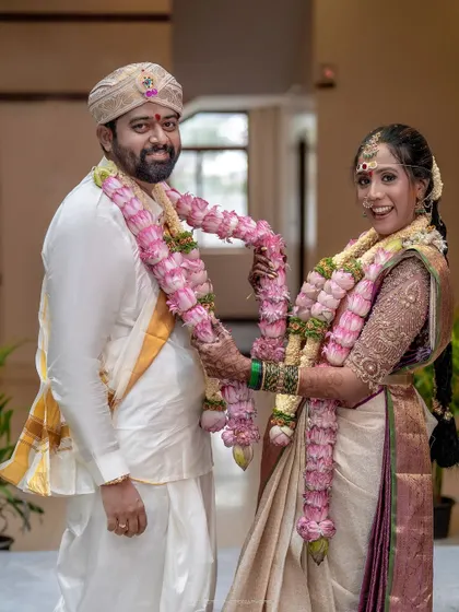 The garland exchange, a playful and significant ritual. I capture the joy and tradition of this moment as the couple officially begins their life together.