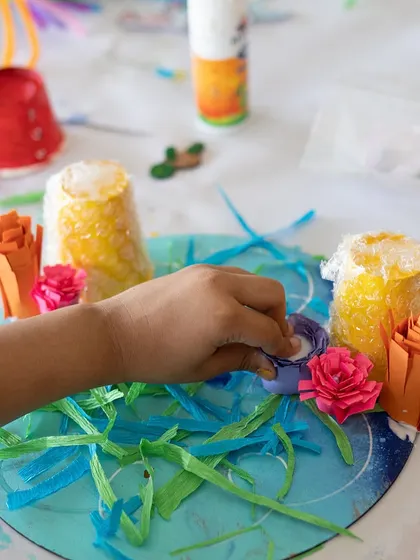Look at the detail in this underwater scene! Using paper cups, ribbons, and other craft supplies, this young creator built a vibrant world. Mixed media art is all about resourcefulness and imagination.