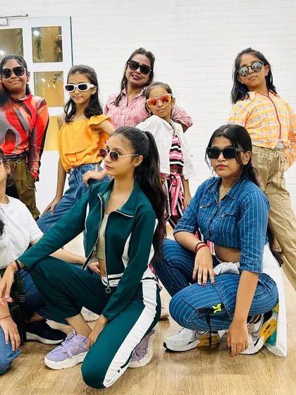 Our teen and adult students posing with attitude. We help you build confidence that you can carry both on and off the dance floor.