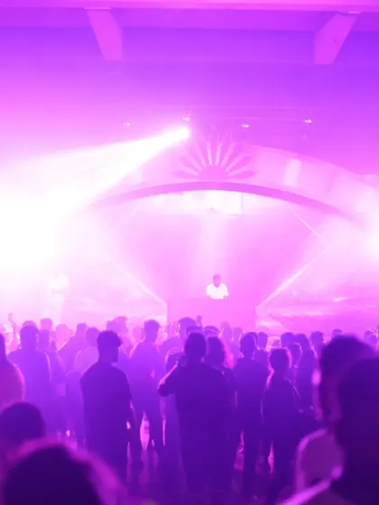 The entire venue washed in purple light during my set. The lighting design is a crucial part of creating an immersive concert experience.