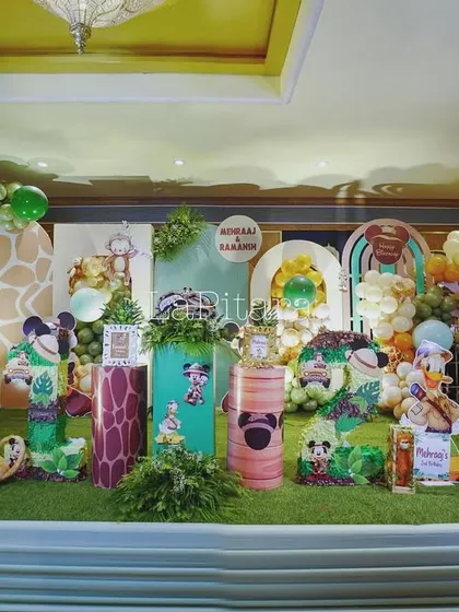 A closer view of the safari stage, detailing the various character cutouts, animal props, and themed pedestals that create a rich and layered scene.
