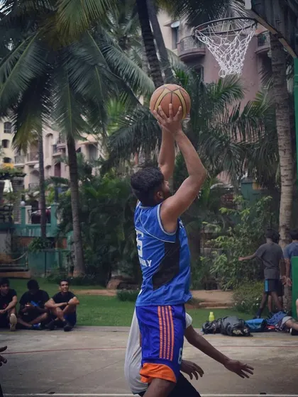 Practicing my shooting form at an outdoor court.