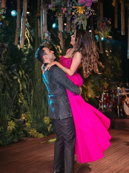 A stunning lift that makes for a perfect photo-finish, capturing the bride's flowing dress and the couple's celebratory spirit.