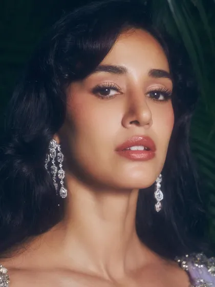 A beauty shot focusing on the makeup for this ethnic look. I used warm, rosy tones on the eyes and lips to create a fresh and radiant appearance.