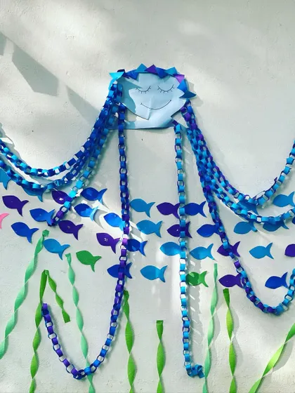 Another look at the intricate, handmade jellyfish wall decoration. The flowing paper-chain tentacles and serene expression made it a favorite photo spot for the kids.
