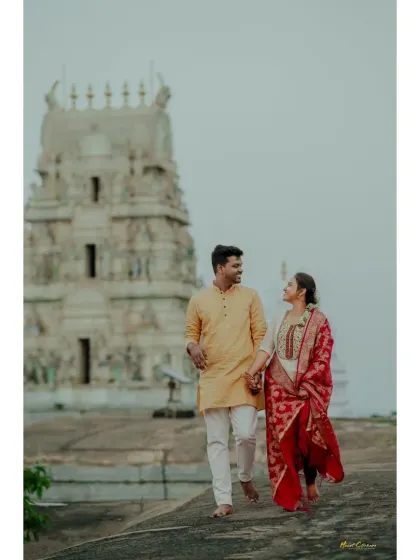 A romantic walk during a pre-wedding shoot with a temple in the background. It's a beautiful blend of love and heritage.
