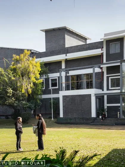 The design of the Media Monks campus revolves around a central green lawn, ensuring every part of the office enjoys a connection to nature. This approach promotes a sense of wellbeing and community.