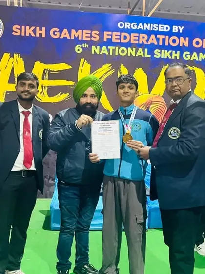 This champion earned his medal through pure dedication. Posing with him at the National Sikh Games was a highlight.