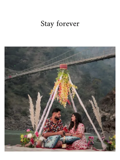 A beautiful shot of the couple making a toast during their romantic picnic, with the words "Stay forever" adding to the sentiment.