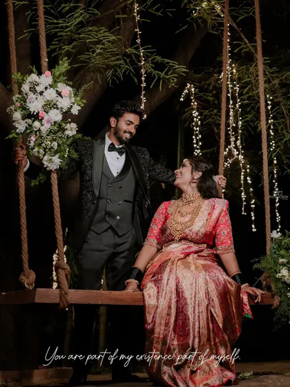 Duplicate of image 106, a romantic shot of the couple on a swing.