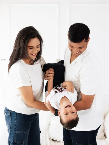 The pure joy of being a kid! This playful, upside-down moment is a perfect example of the candid, fun-filled shots I love to capture during family sessions.