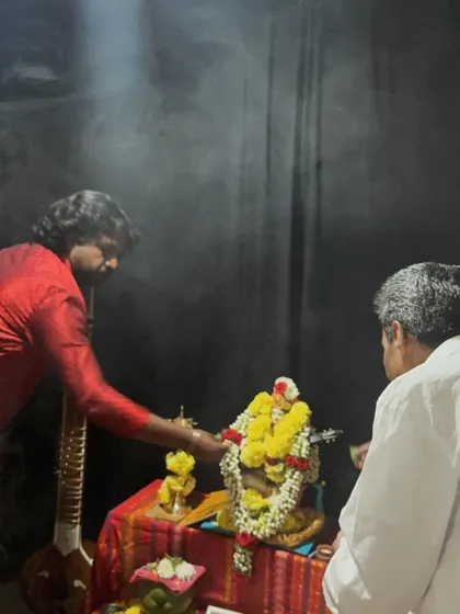 The sacred smoke of incense during our Saraswati Pooja, with a sitar resting in the background, ready for the music to begin.