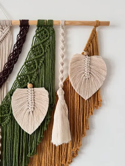 A detailed shot of the macrame leaves and tassels on this custom piece. Each leaf is carefully knotted and brushed out to create that perfect shape.